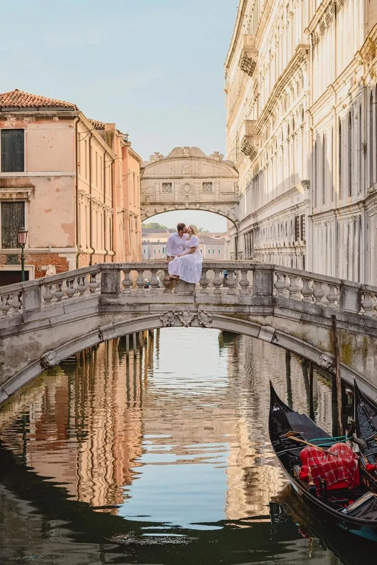 Couple during their engagement photoshoot at Piazza San Marco at sunrise, showcasing the best proposal Venice experience.