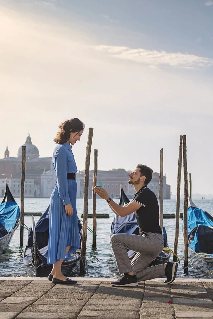 Couple during their photoshoot for their Venice best proposal in front of the Basilica San Marco.