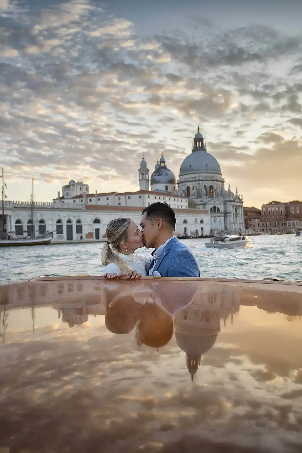 Couple during their engagement photoshoot at Piazza San Marco at sunrise, showcasing the best proposal Venice experience.