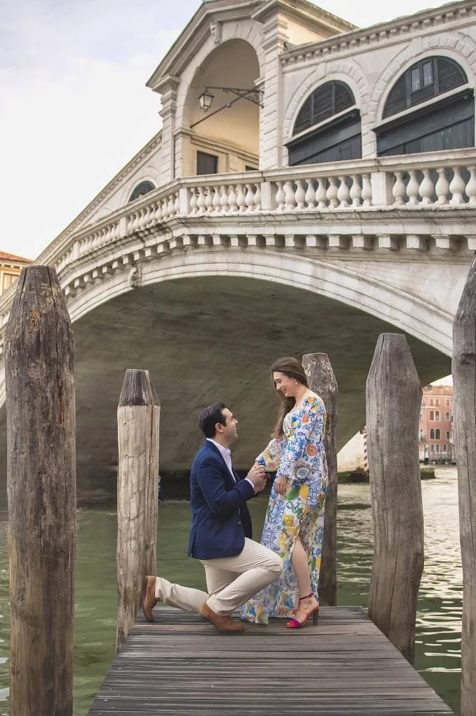 Couple during their engagement photoshoot at Rialto at sunrise, showcasing the best proposal Venice experience