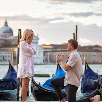 A man on one knee proposing on the Riva degli Schiavoni, with views of the Grand Canal – best proposal Venice moment.