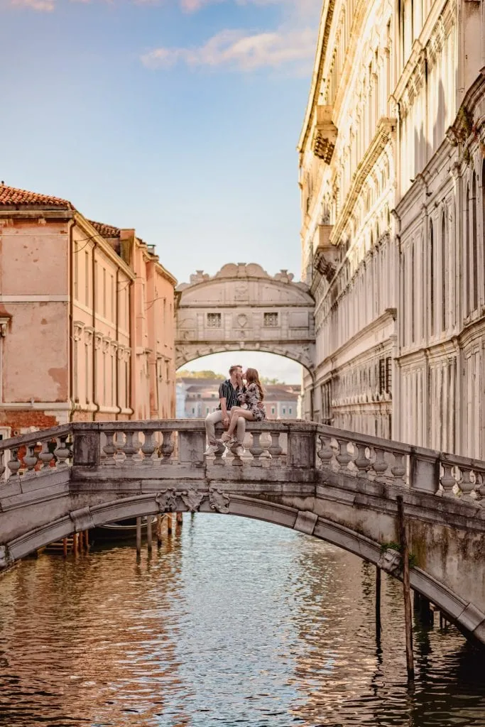 Couple during their engagement photoshoot at Piazza San Marco at sunrise, showcasing the best proposal Venice experience.