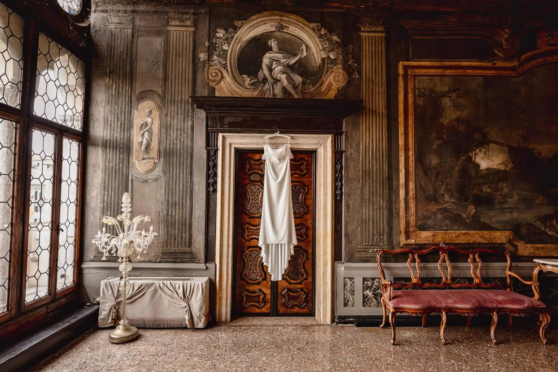 Bride getting ready in luxurious Ca’ Sagredo suite for Venice elopemen
