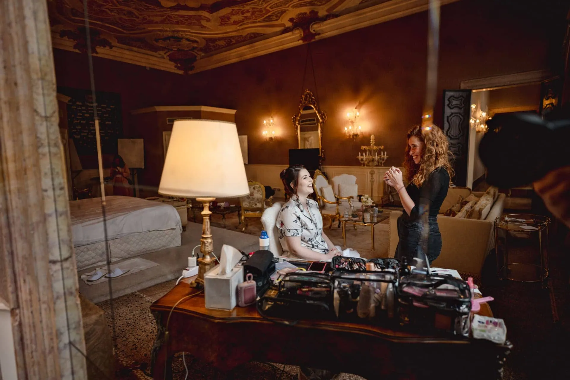 Bride getting ready in luxurious Ca’ Sagredo suite for Venice elopement