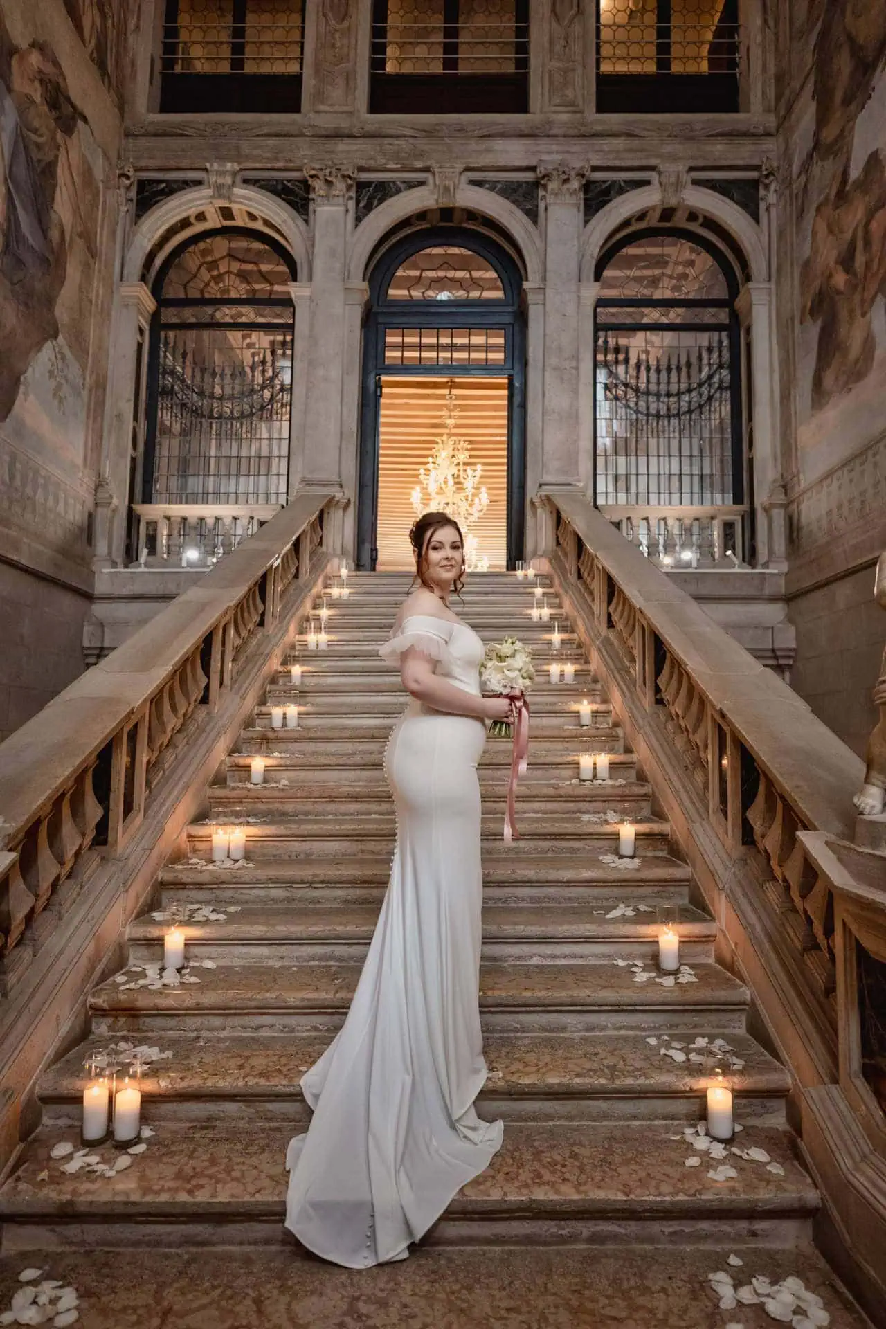 Bride getting ready in luxurious Ca’ Sagredo suite for Venice elopement