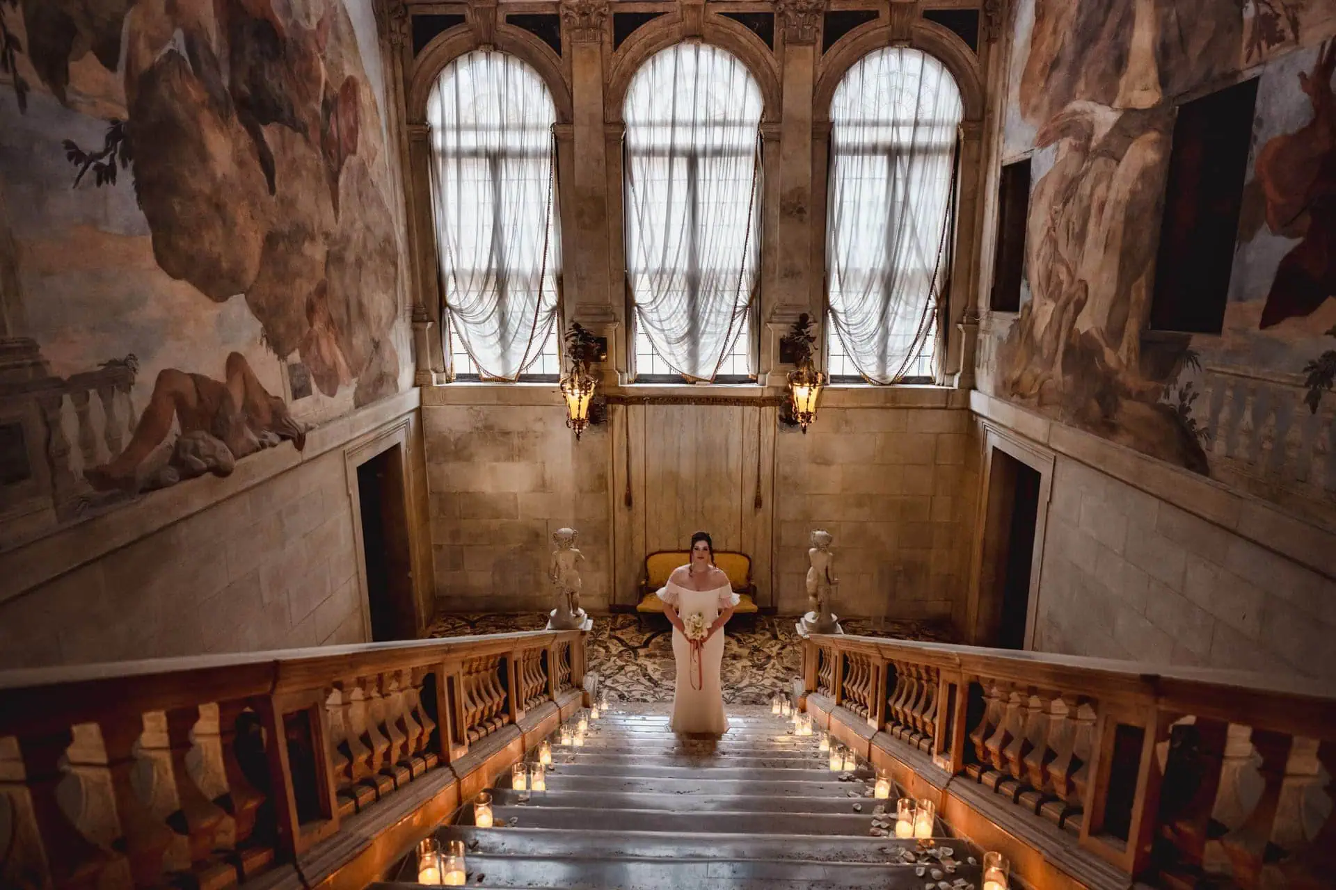 Bride getting ready in luxurious Ca’ Sagredo suite for Venice elopement