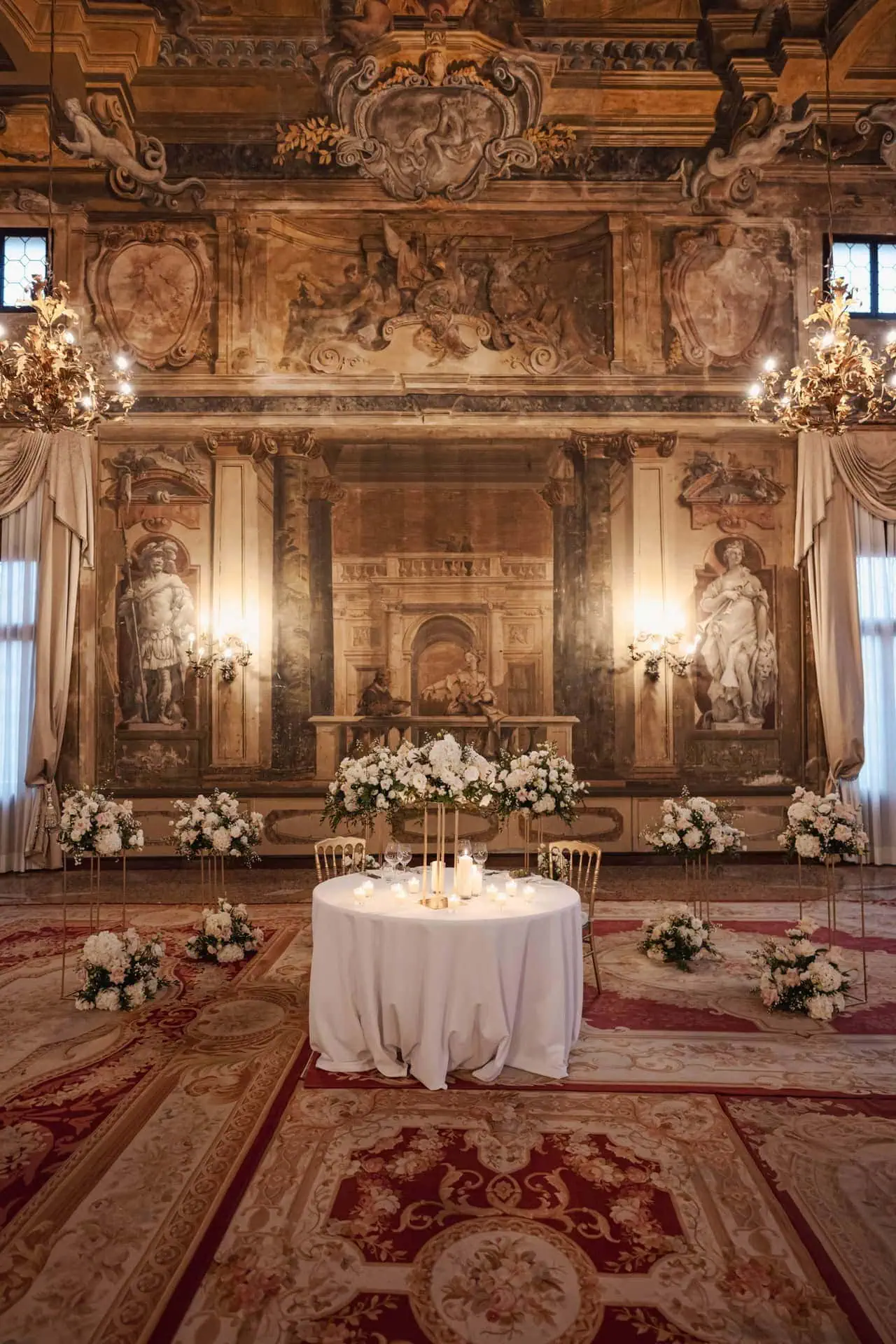 Couple having candlelit dinner at Ca’ Sagredo Hotel Venice after elopement