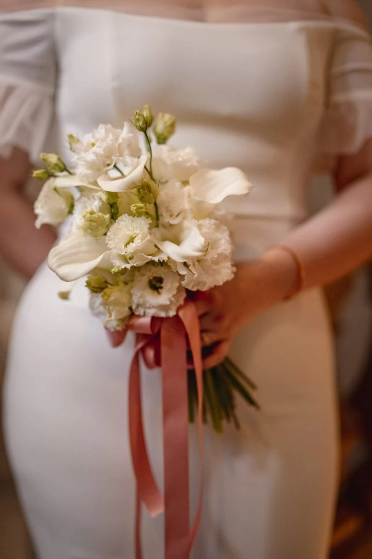 Bride and groom on the grand staircase of Ca’ Sagredo for wedding photos in Venice