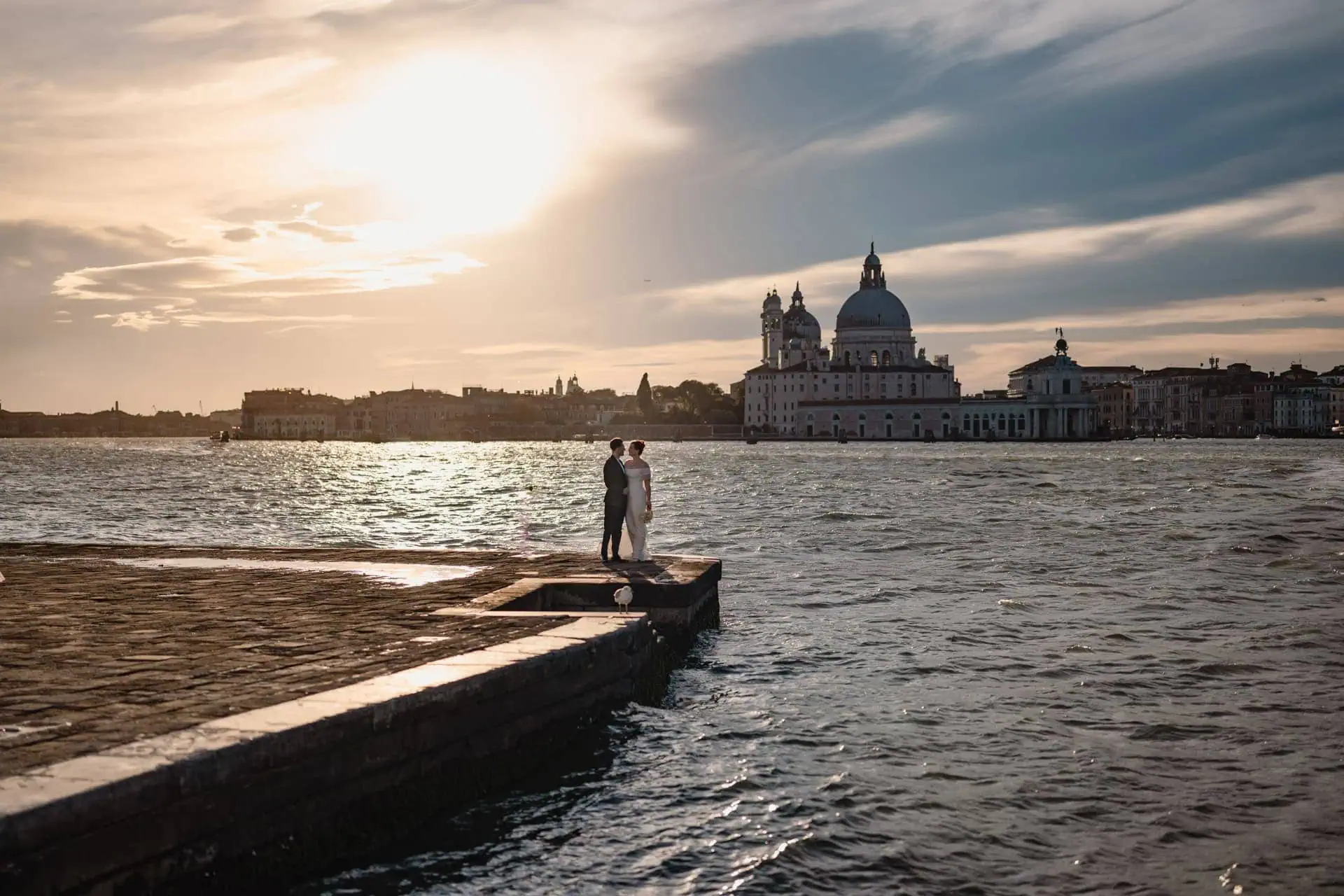 Couple at San Giorgio Maggiore with panoramic view of Venice lagoon