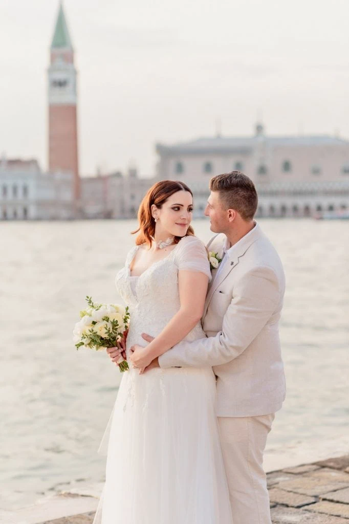 Elopement couple at San Giorgio Maggiore with Venice’s skyline in the background – Elopement Venice Wedding Photography.