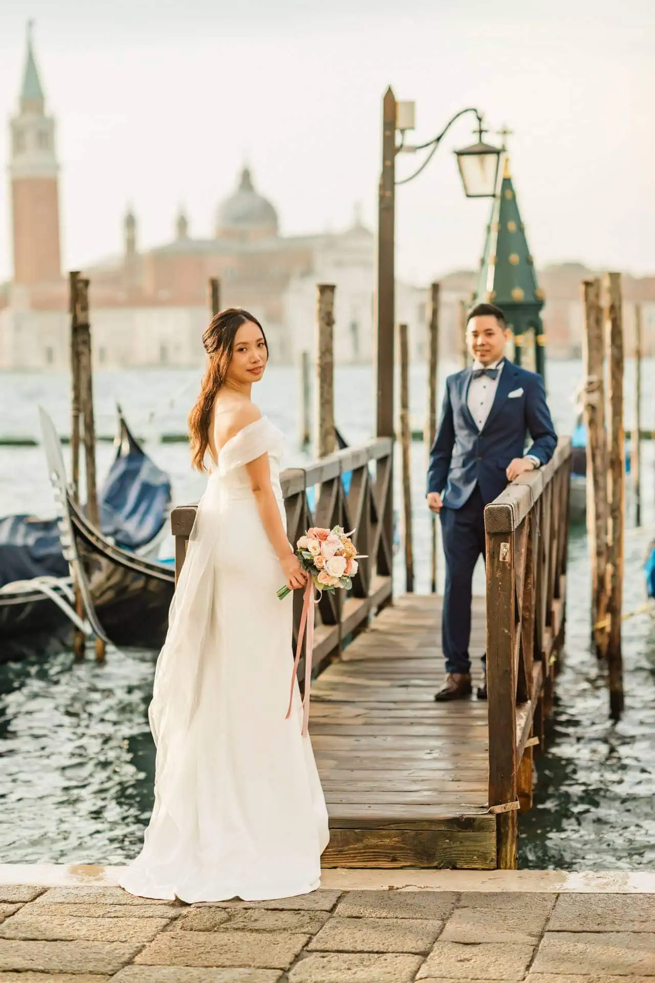 Couple posing at the grand entrance of Santa Maria della Salute in Venice – Venice Wedding Photography Engagement.