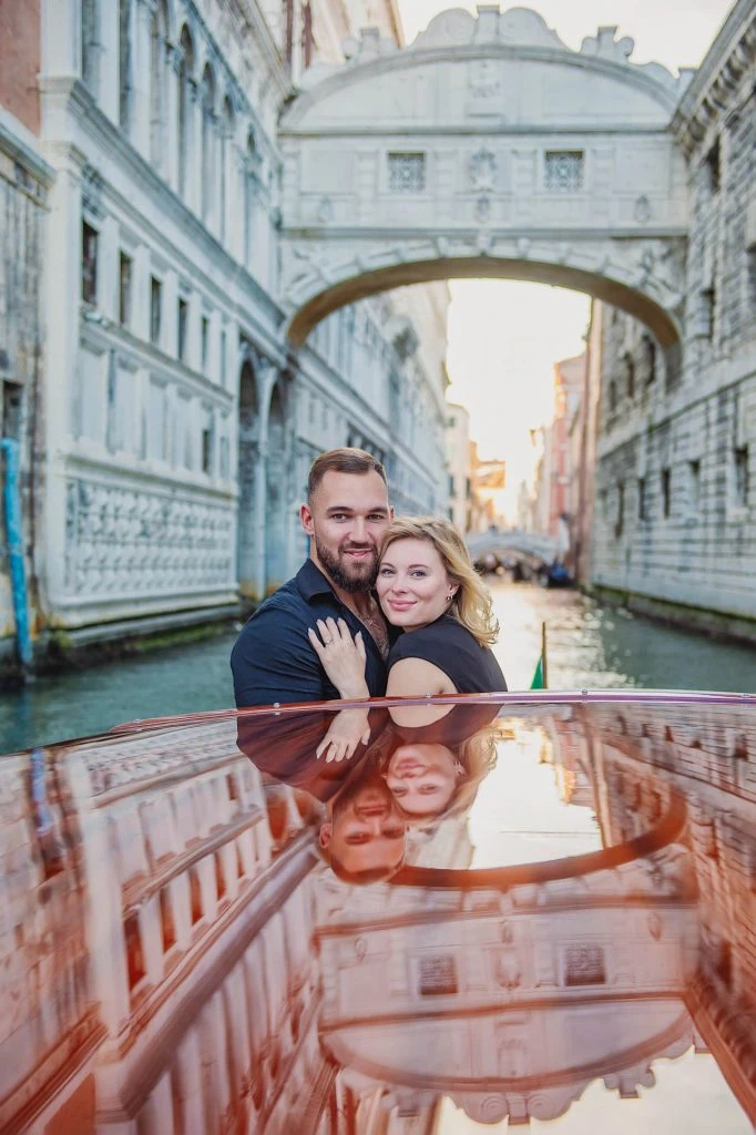 Surprise proposal on a gondola under the Bridge of Sighs – Venice engagement photography.