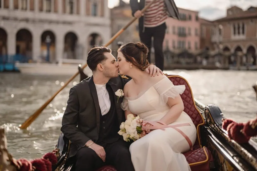 Couple on a gondola ride in Venice after their symbolic elopement ceremony