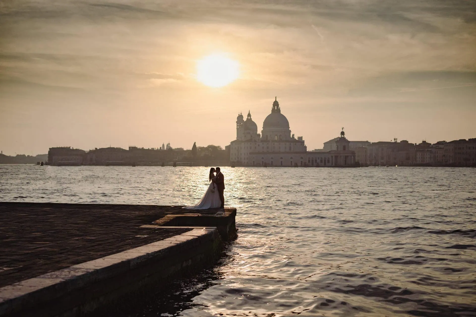 Couple at San Giorgio Maggiore with panoramic view of Venice lagoon