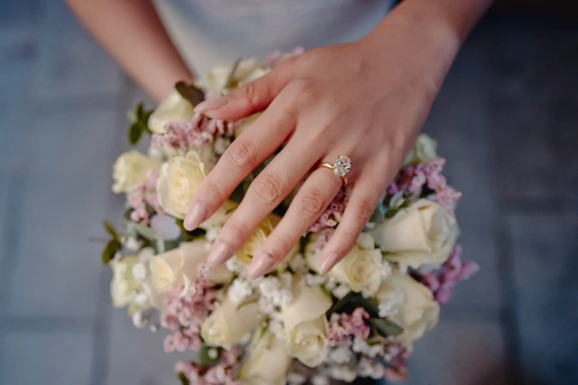 Happy couple celebrating engagement in front of the Basilica di San Marco – Venice proposal photographer.