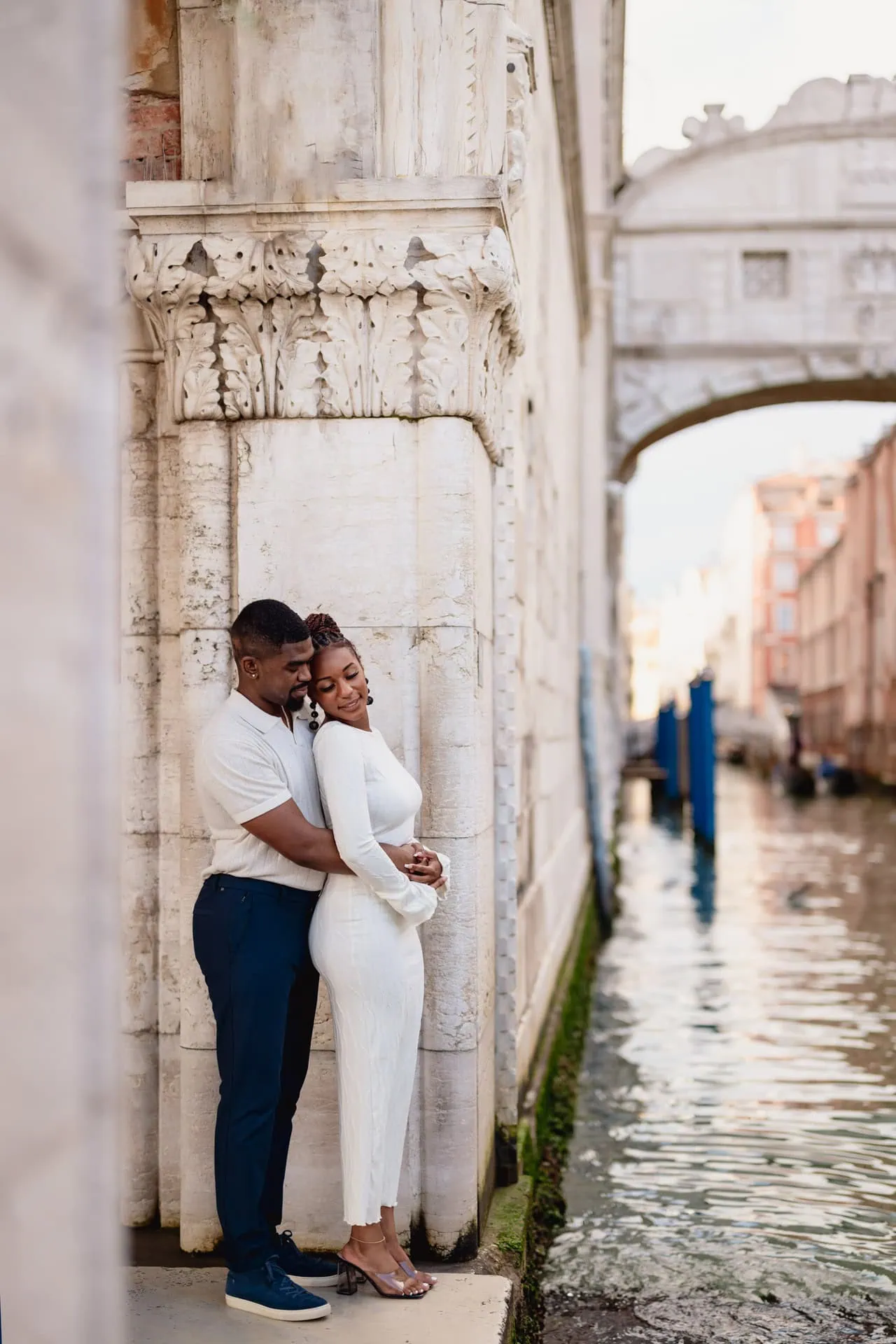 Surprise proposal on a gondola under the Bridge of Sighs – Venice engagement photography.