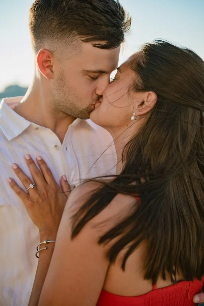 Happy couple celebrating engagement in front of the Basilica di San Marco – Venice proposal photographer.