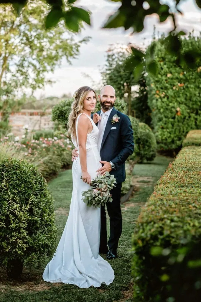 A couple enjoying their wedding ceremony in the gardens of Locanda Cipriani on Torcello Island – wedding photography Venice.