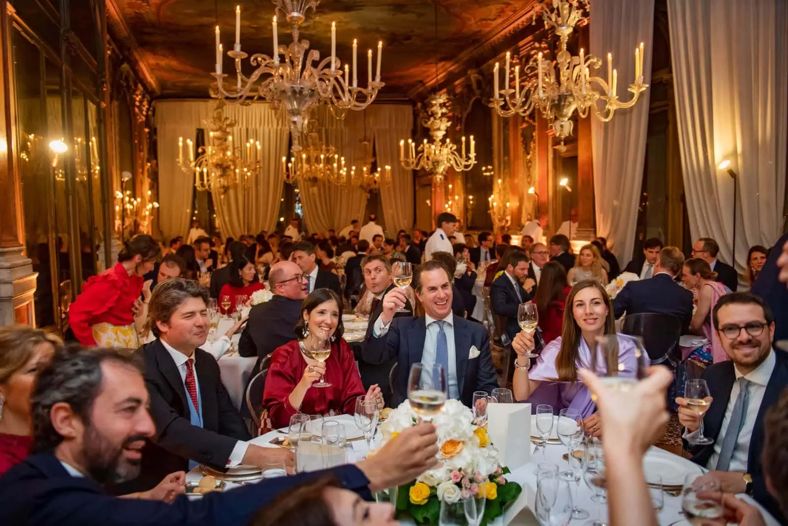 Stylish guest attire in Venice for a formal wedding.