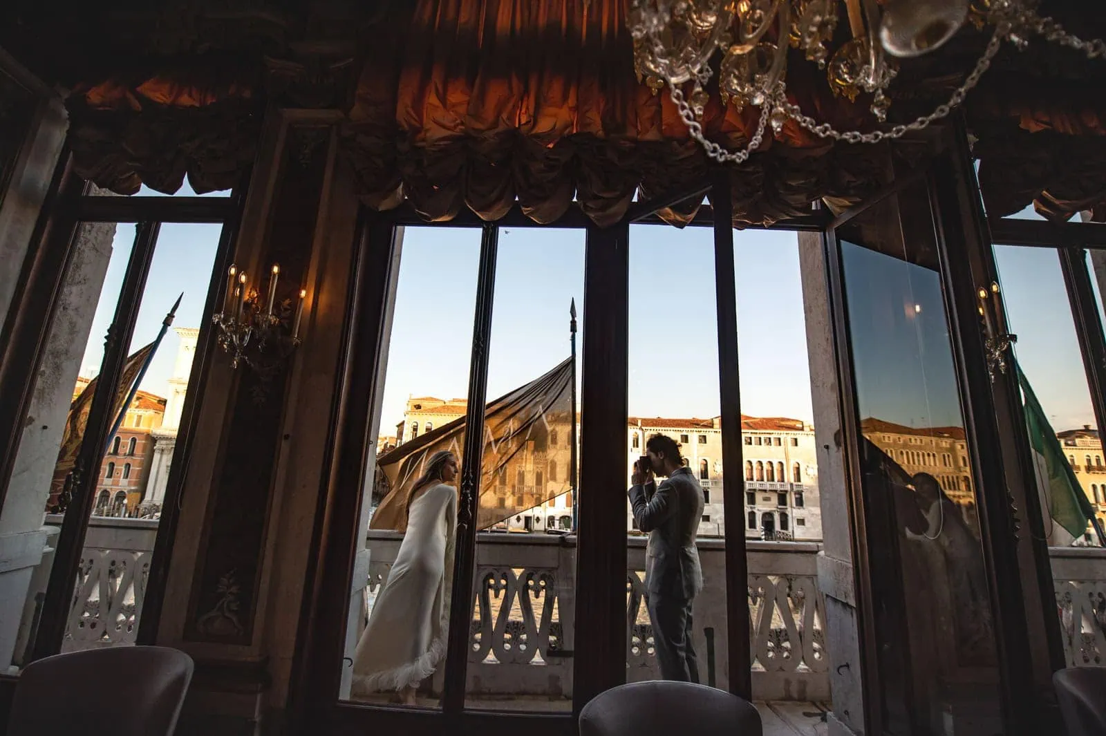 Stylish guest attire in Venice for a formal wedding.