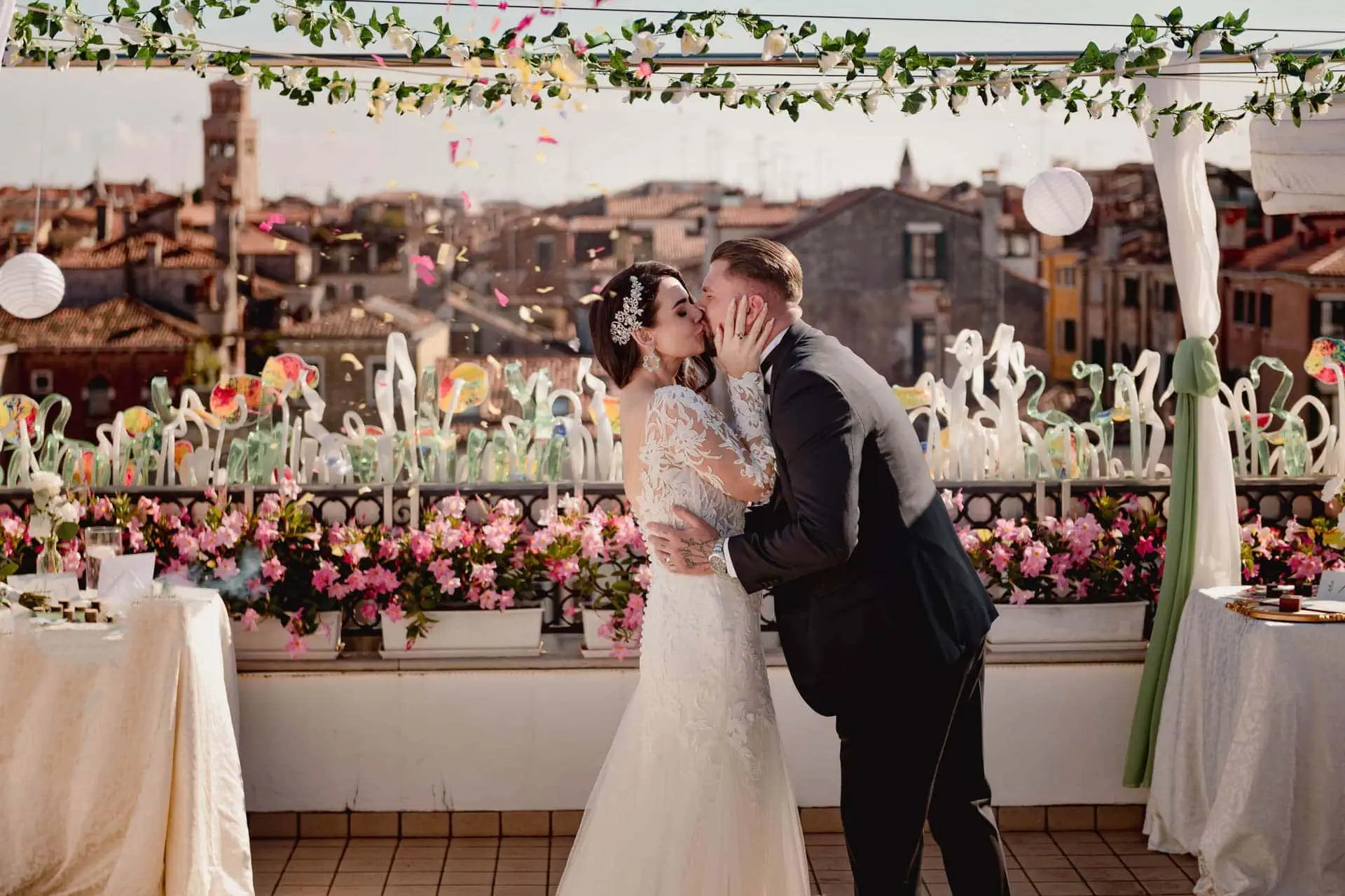A couple during a symbolic wedding in Venice captured on the rooftop terrace of a stunning Venetian palace.