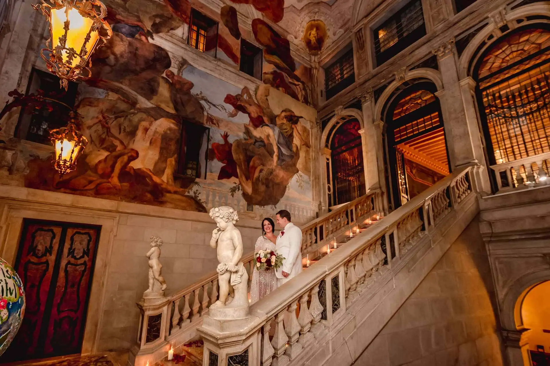 A couple during a symbolic wedding in Venice captured inside a luxurious private palace, surrounded by elegant decor.