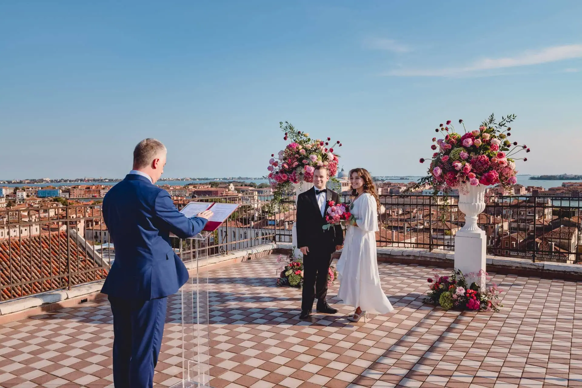 A couple during a symbolic wedding in Venice captured on the rooftop terrace of a stunning Venetian palace.