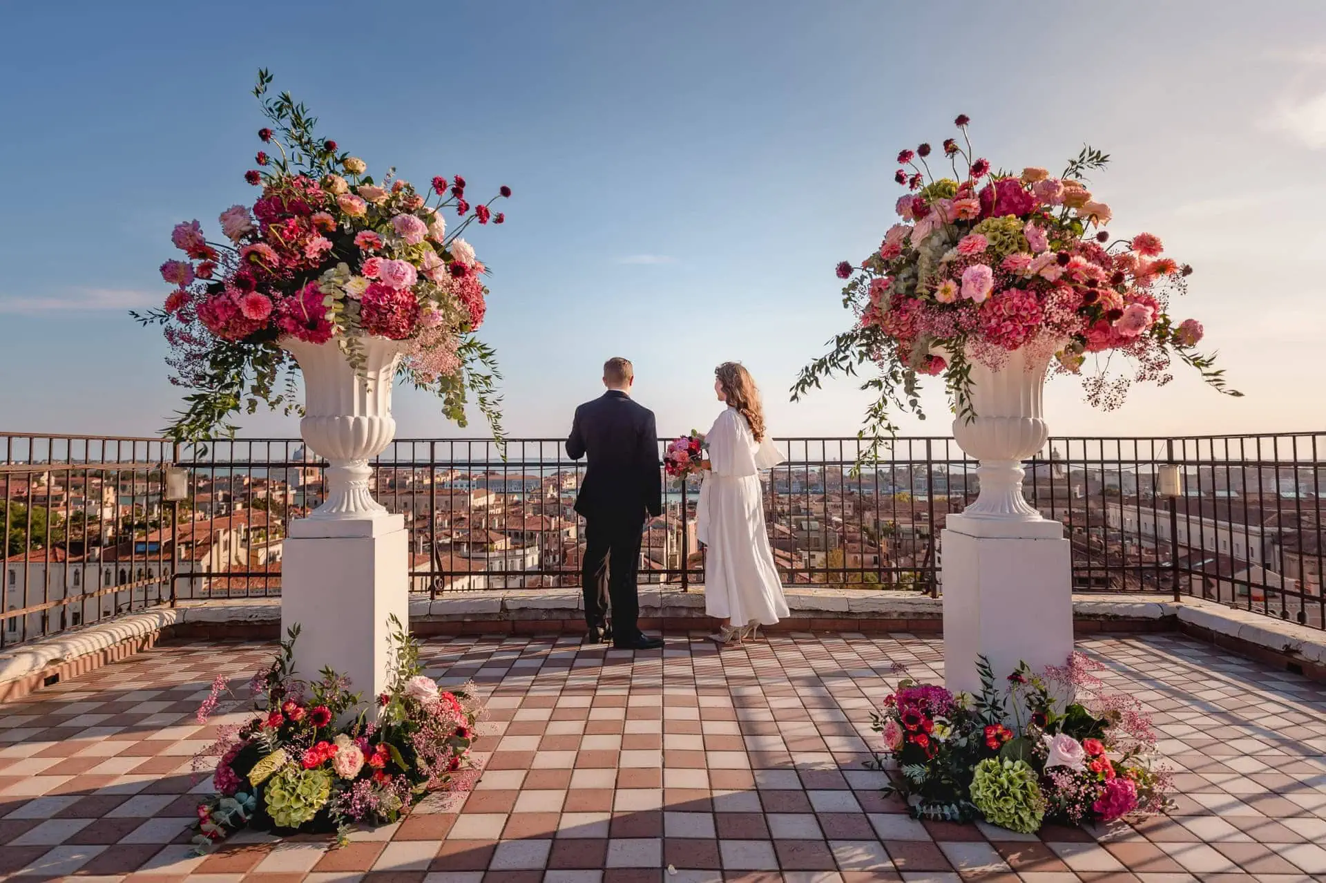 A couple during a symbolic wedding in Venice captured on the rooftop terrace of a stunning Venetian palace.