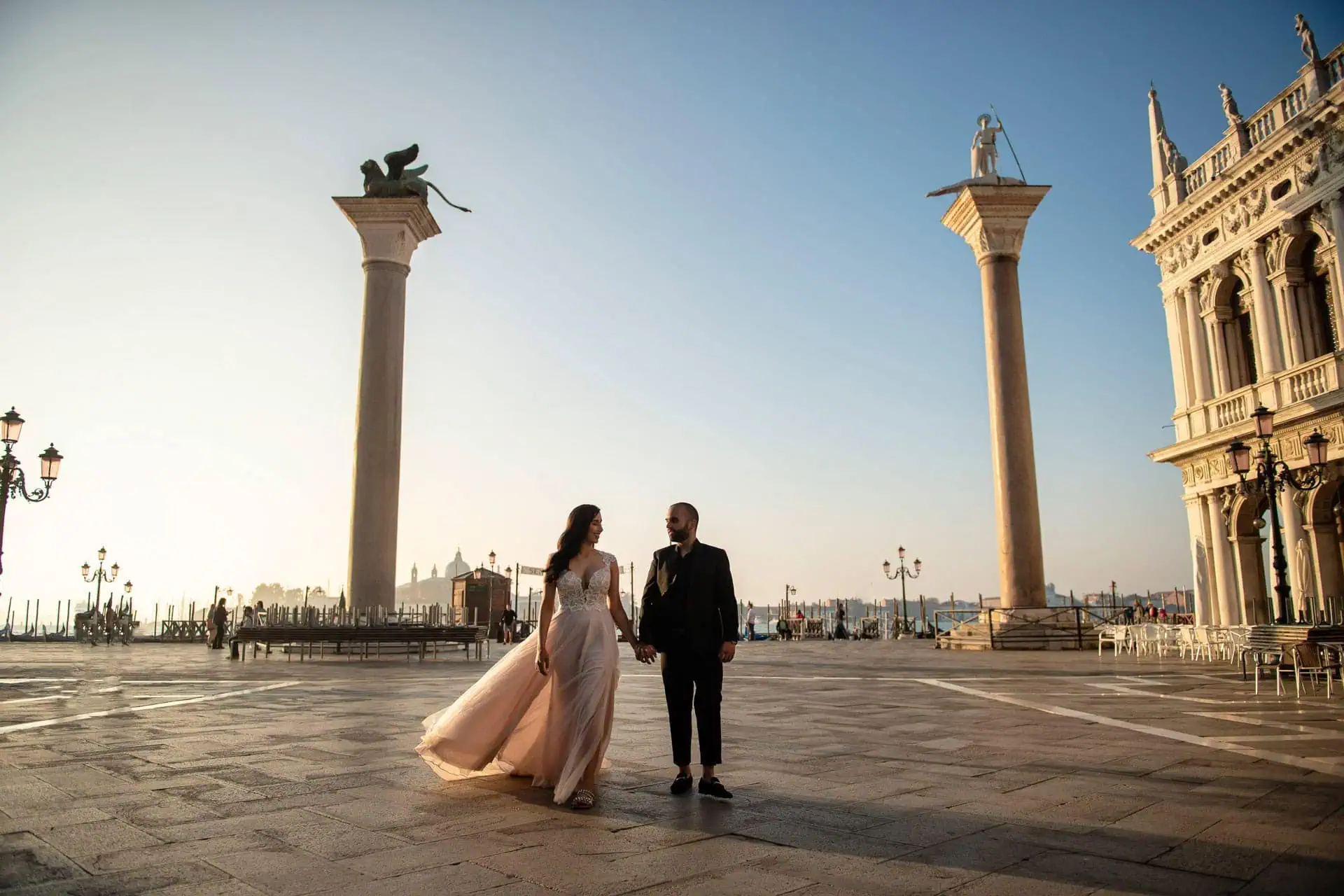 Couple during their engagement photoshoot at Piazza San Marco at sunrise, showcasing the best proposal Venice experience.