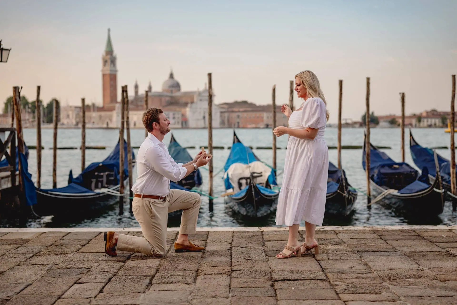 Romantic proposal at sunrise in Piazza San Marco, one of the best places to propose in Venice.