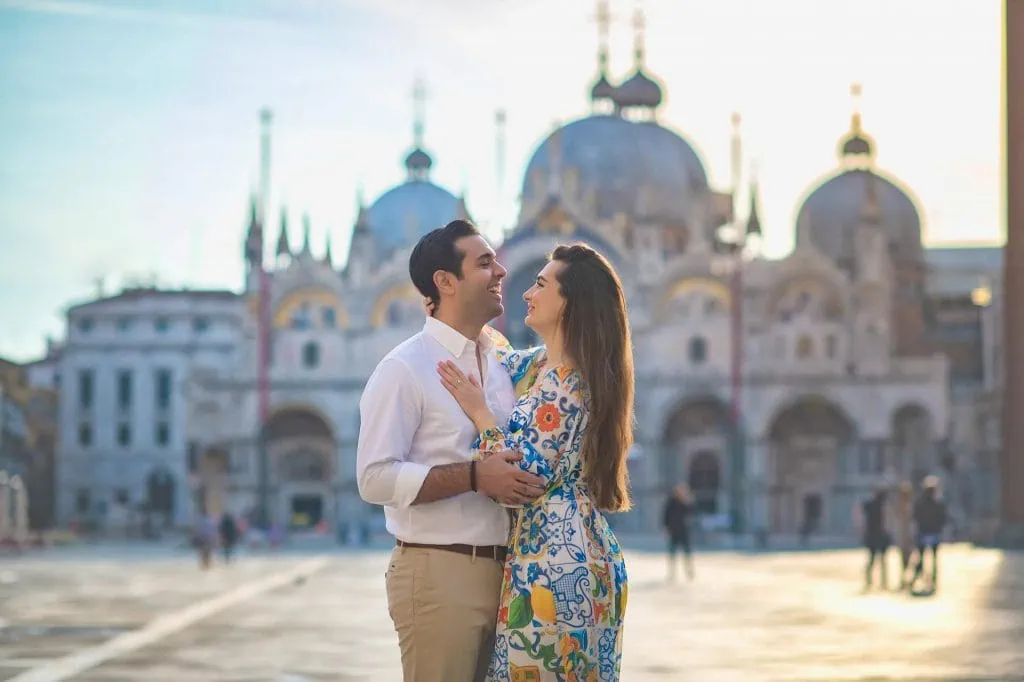 Couple during their engagement photoshoot at Piazza San Marco at sunrise, showcasing the best proposal Venice experience