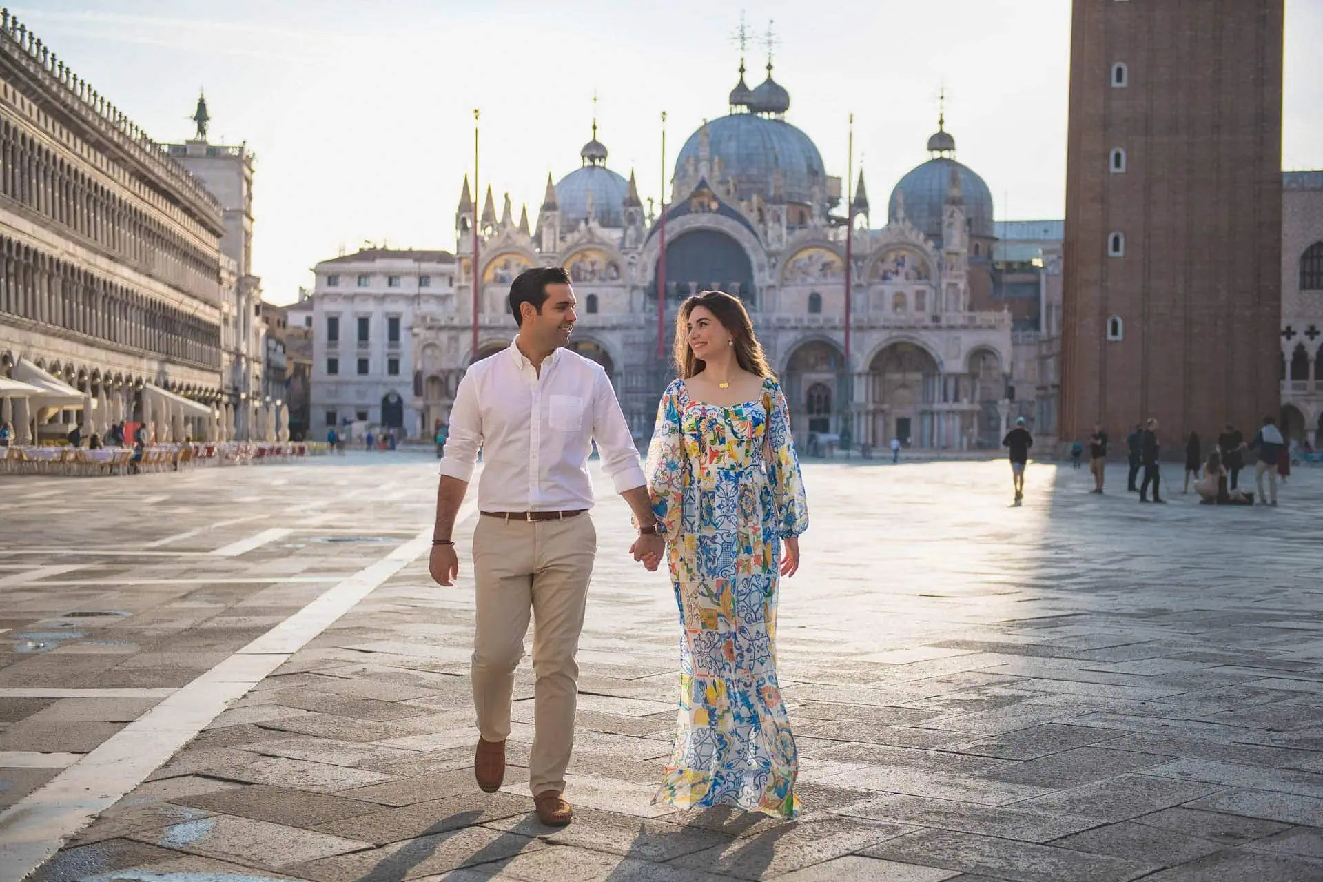 Couple during their engagement photoshoot at Piazza San Marco at sunrise, showcasing the best proposal Venice experience