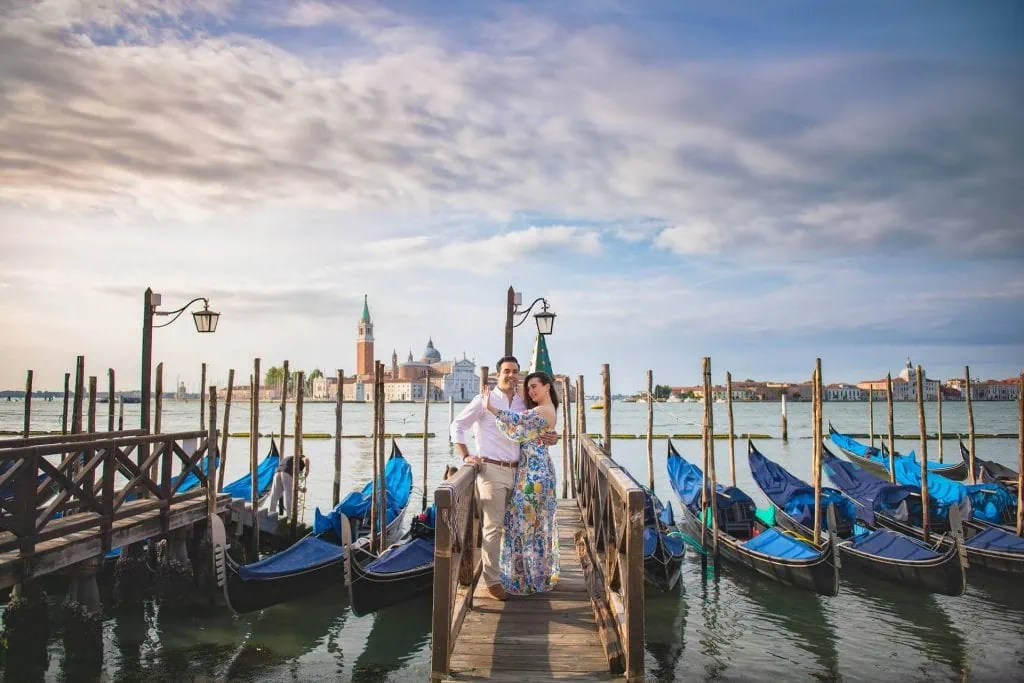 Couple during their engagement photoshoot at Piazza San Marco at sunrise, showcasing the best proposal Venice experience