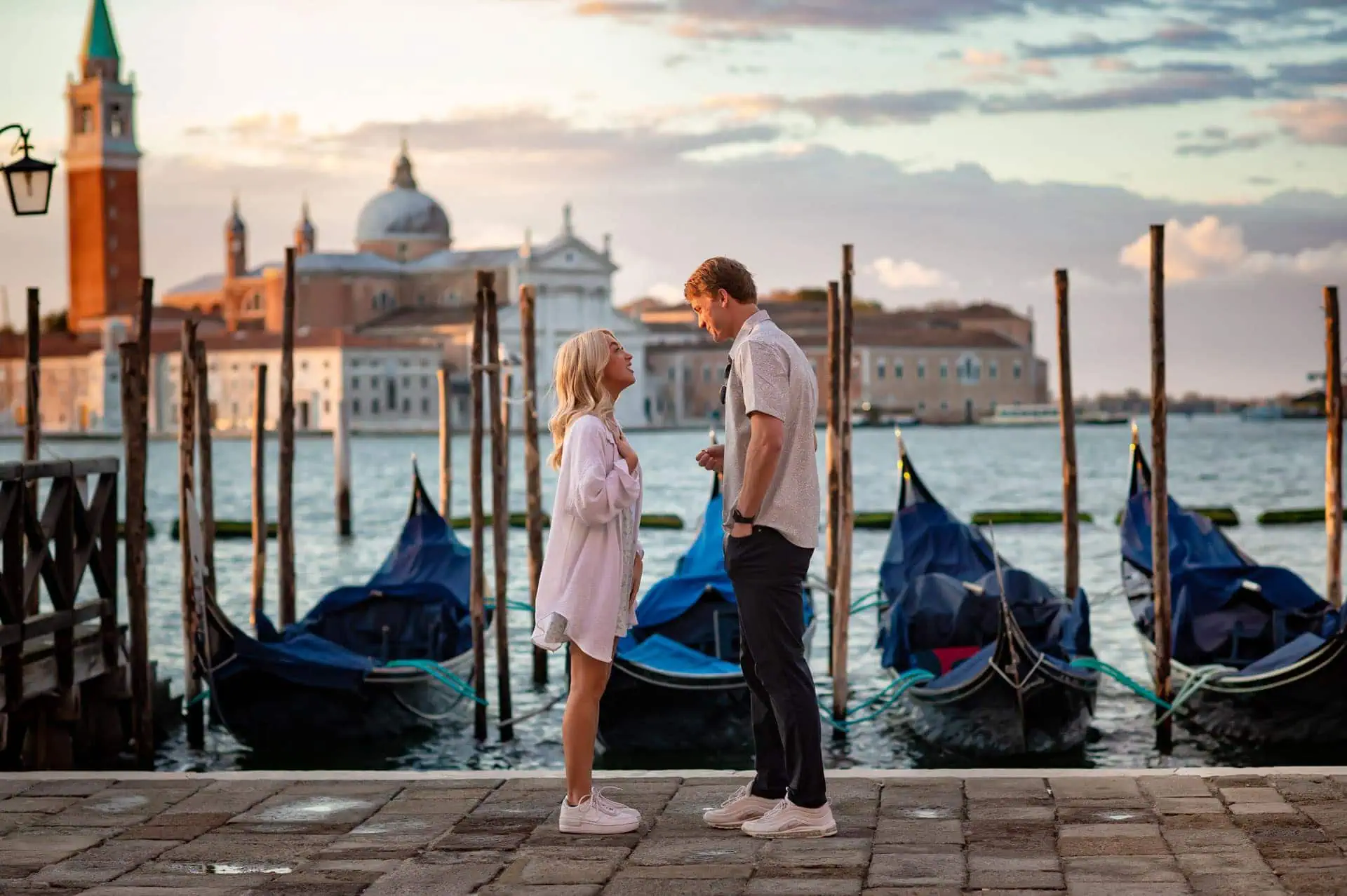 Couple during their engagement photoshoot at Piazza San Marco at sunrise, showcasing the best proposal Venice experience