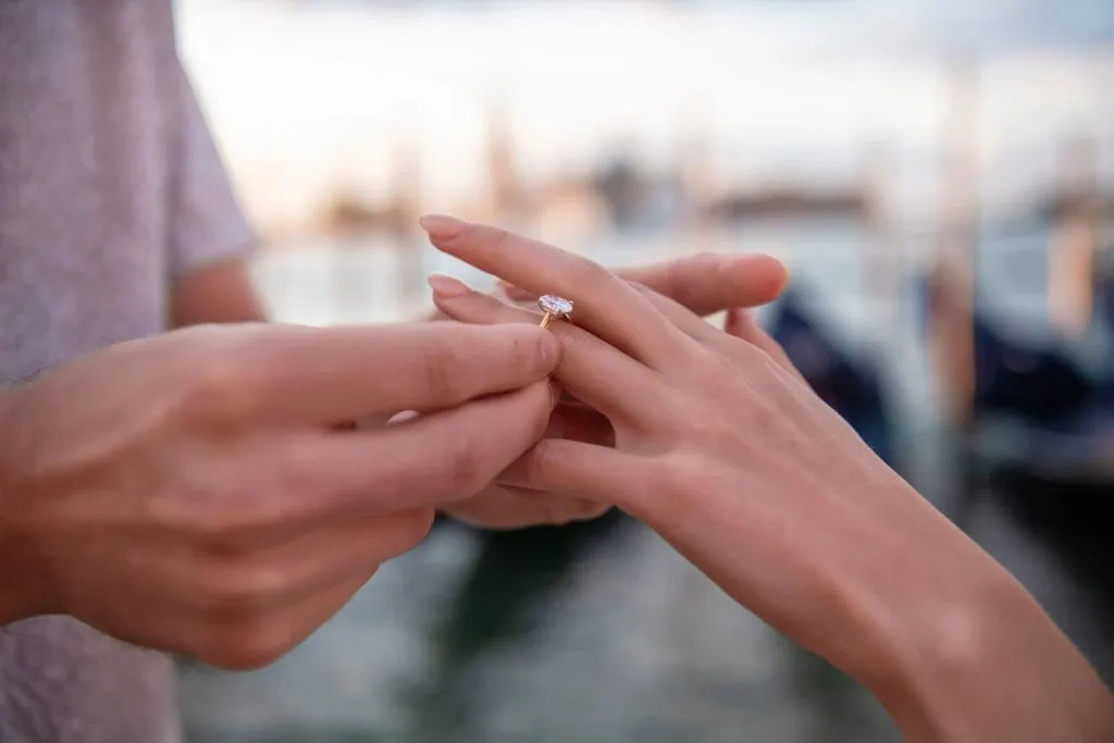 Romantic proposal at sunrise in Piazza San Marco, one of the best places to propose in Venice.