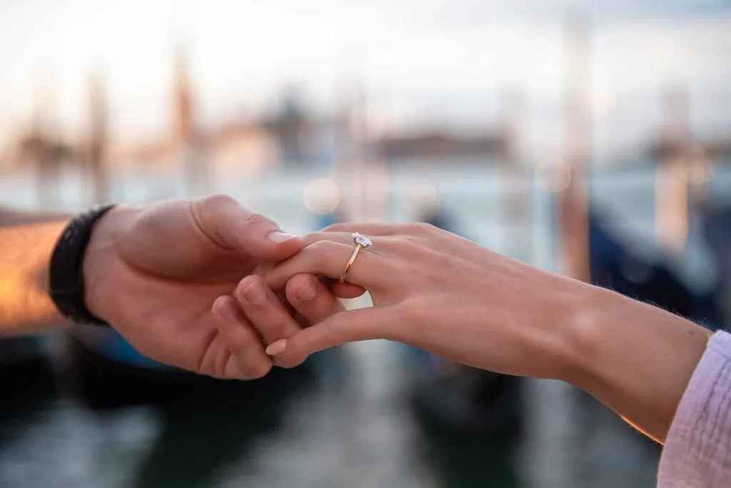 Couple during their engagement photoshoot at Piazza San Marco at sunrise, showcasing the best proposal Venice experience