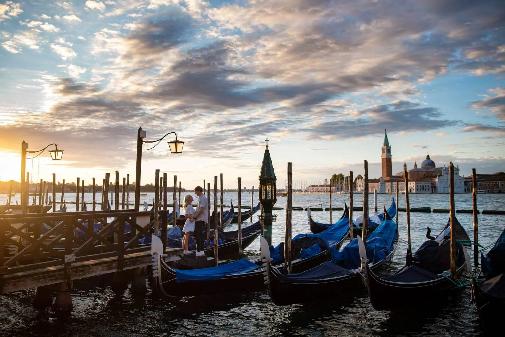 Couple during their engagement photoshoot at Piazza San Marco at sunrise, showcasing the best proposal Venice experience
