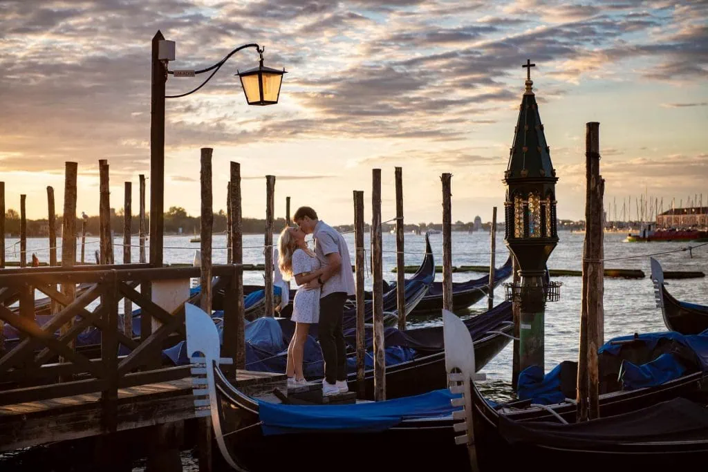 Couple during their engagement photoshoot at Piazza San Marco at sunrise, showcasing the best proposal Venice experience