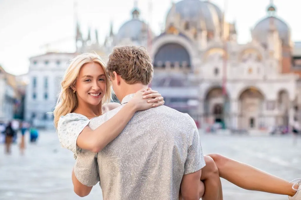 Couple during their engagement photoshoot at Piazza San Marco at sunrise, showcasing the best proposal Venice experience