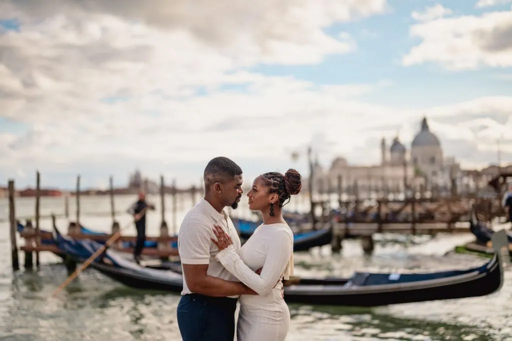 Couple during their engagement photoshoot at Piazza San Marco at sunrise, showcasing the best proposal Venice experience.