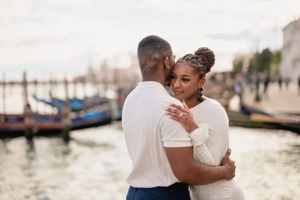 Couple during their engagement photoshoot at Piazza San Marco at sunrise, showcasing the best proposal Venice experience.