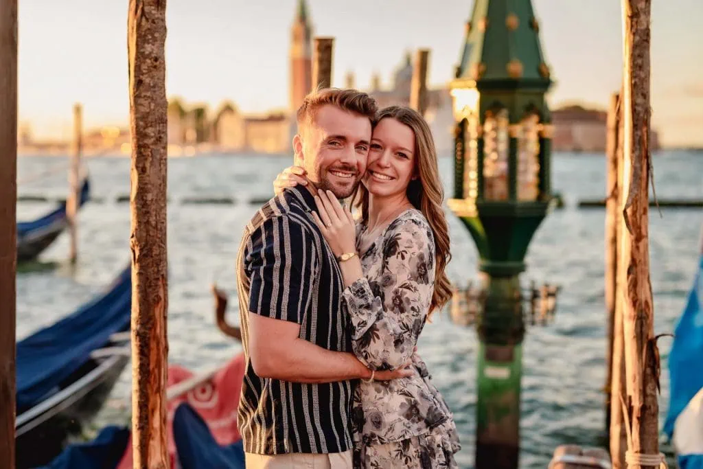 Couple during their engagement photoshoot at Piazza San Marco at sunrise, showcasing the best proposal Venice experience.