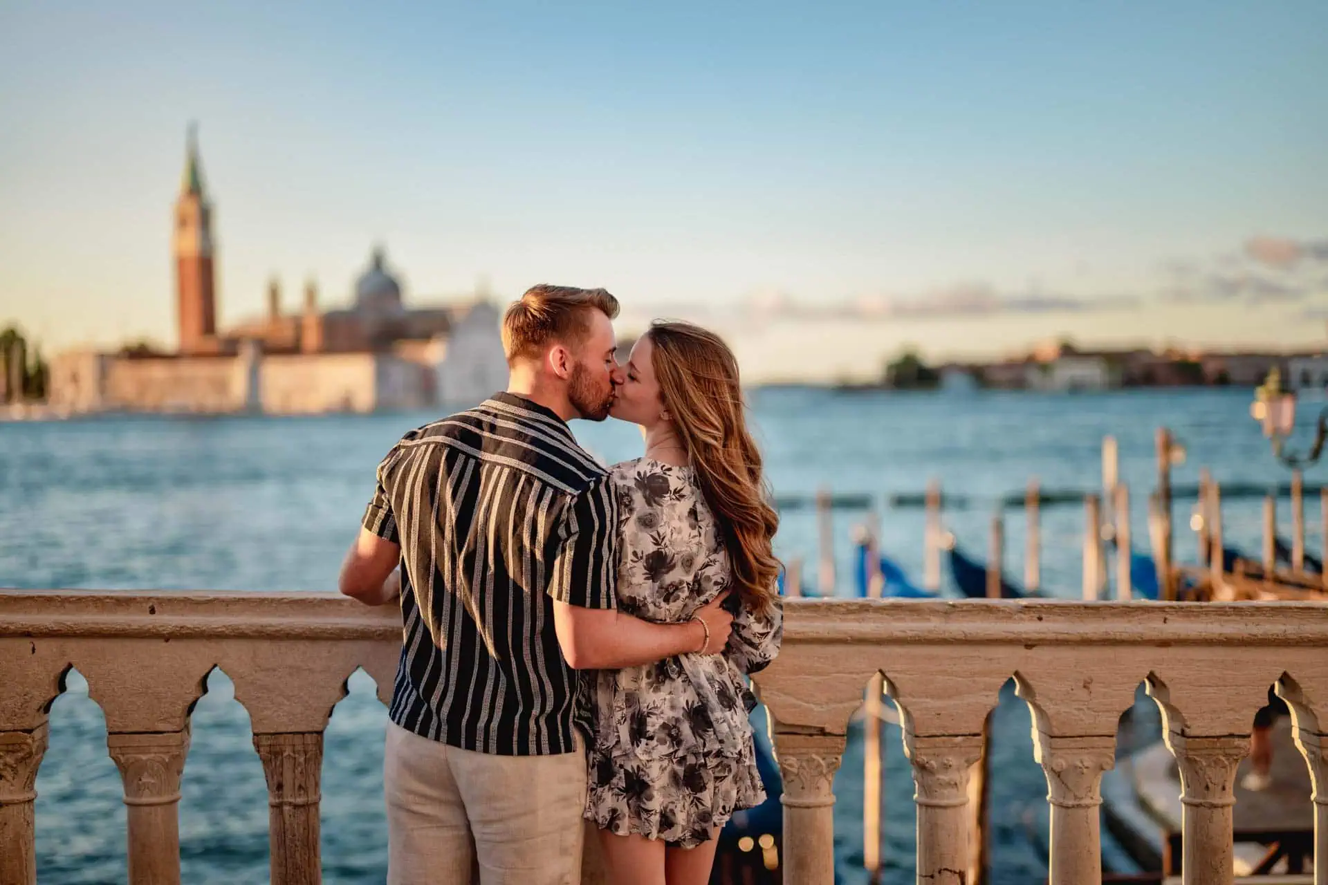 Couple during their engagement photoshoot at Piazza San Marco at sunrise, showcasing the best proposal Venice experience.