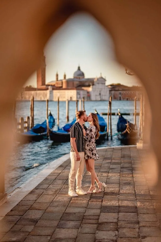 Couple during their engagement photoshoot at Piazza San Marco at sunrise, showcasing the best proposal Venice experience.
