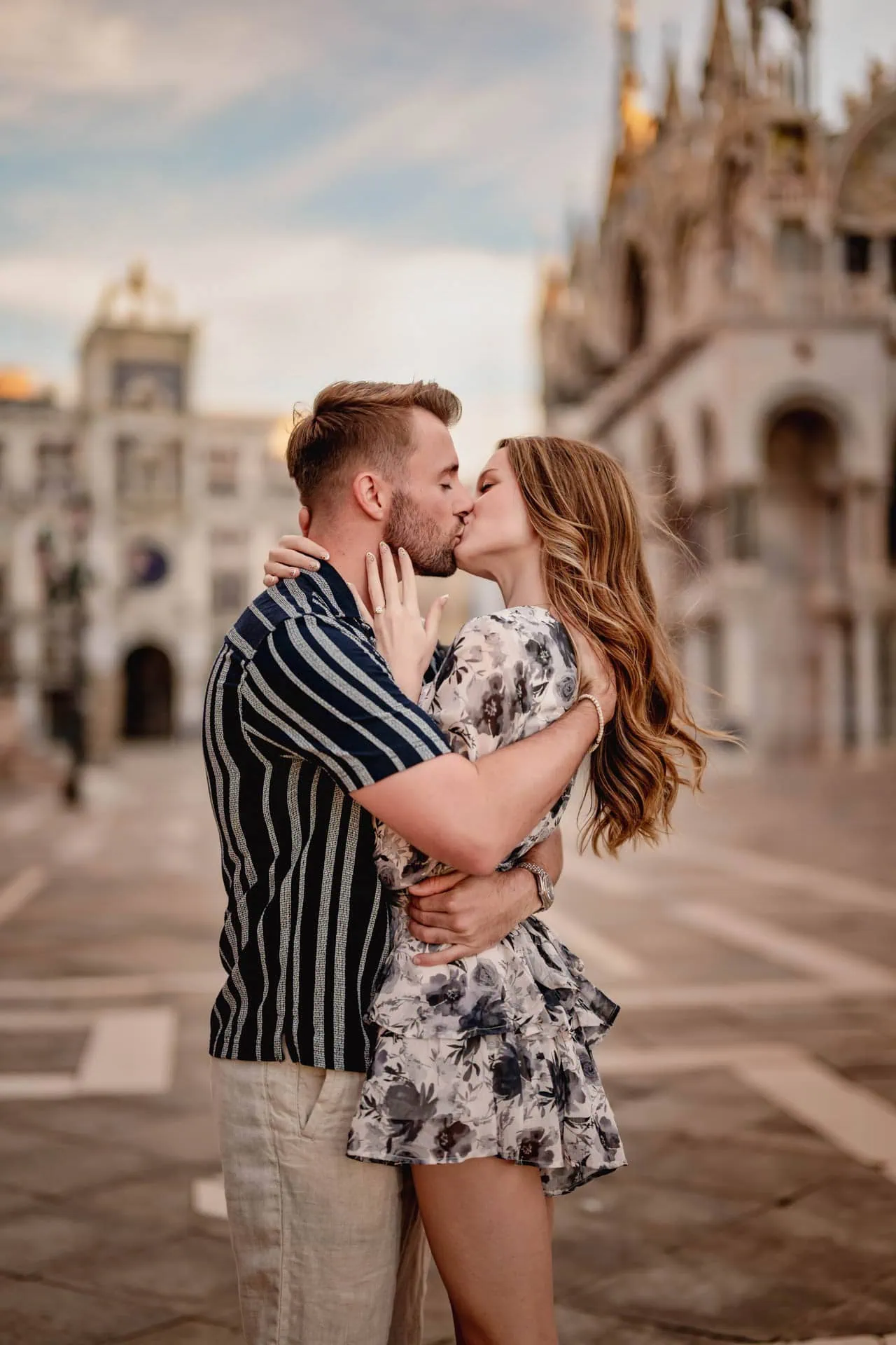 Couple during their engagement photoshoot at Piazza San Marco at sunrise, showcasing the best proposal Venice experience.