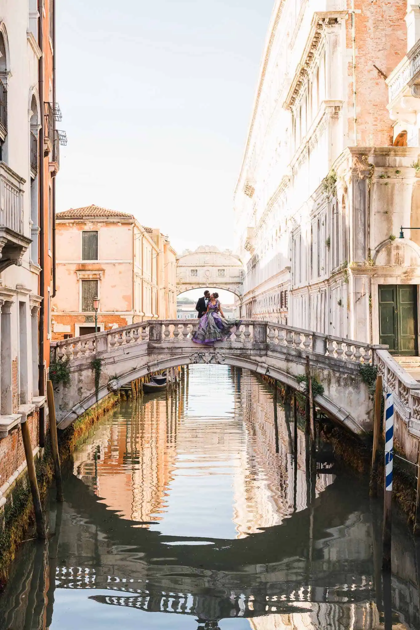 Couple on bridge in Venice.