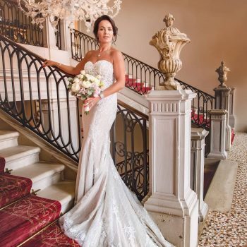 A bride during a symbolic wedding in Venice captured inside a luxurious private palace, surrounded by elegant decor