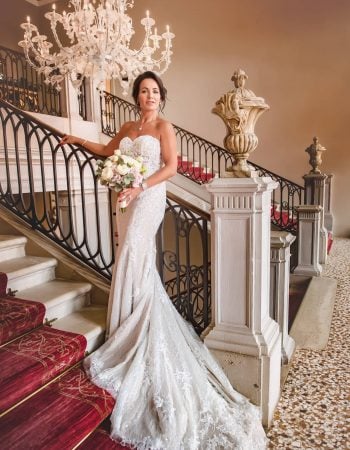 A bride during a symbolic wedding in Venice captured inside a luxurious private palace, surrounded by elegant decor