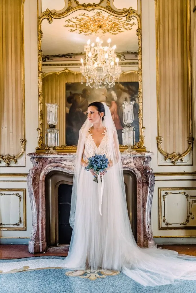 A couple during a symbolic wedding in Venice captured in the lush garden of a private palace.