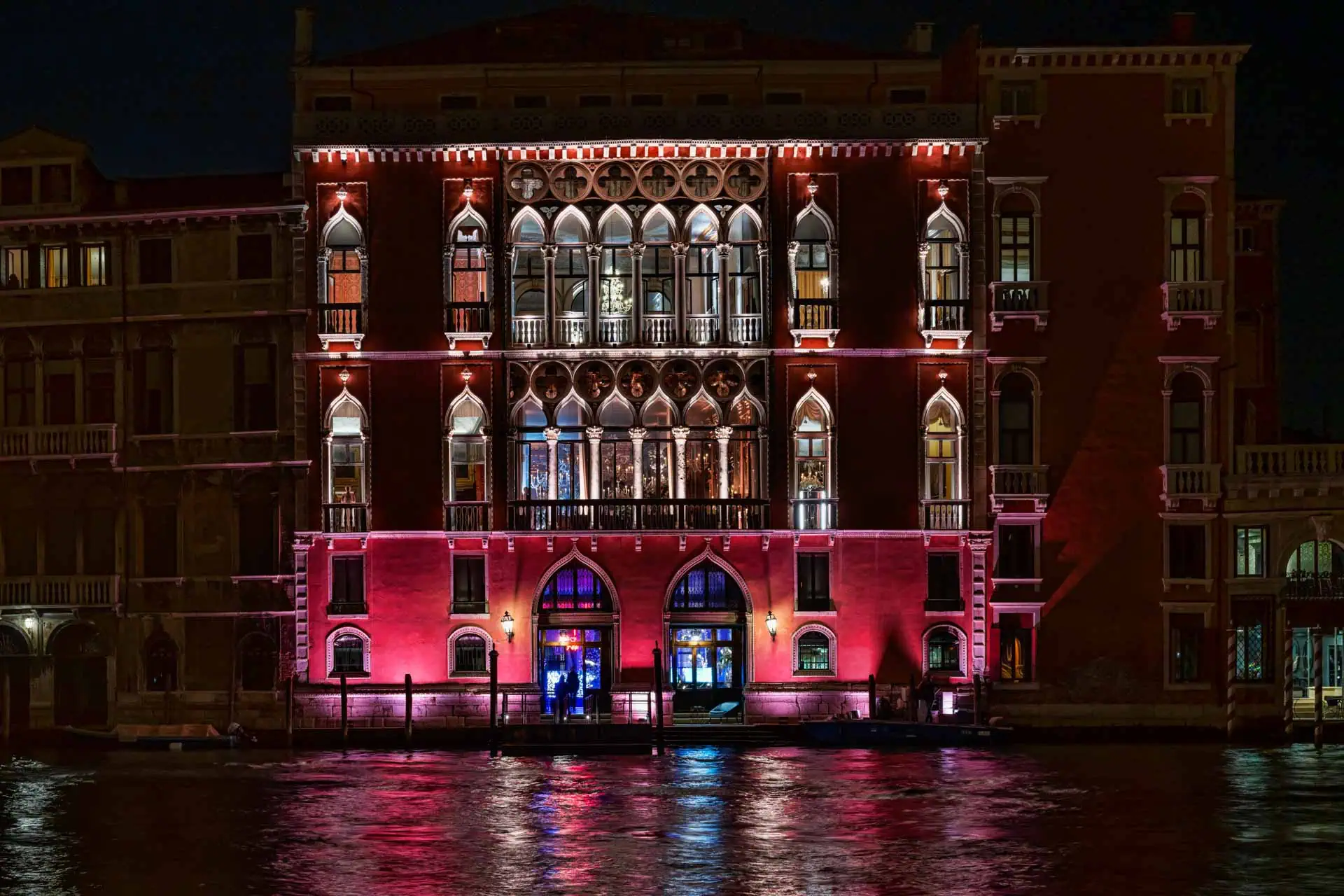 A couple during a symbolic wedding in Venice captured inside the historic Pisani Moretta palace.